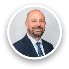 Portrait of Greg Mendoza, professional team member at Carey UK